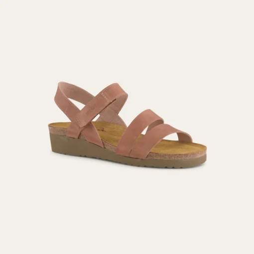 Naot Women's Kayla Sandal featuring a sleek leather upper, three-strap design, cork and latex footbed, adjustable strap, and durable EVA sole for all-day comfort.