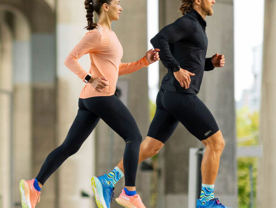 couple jogging in hoka shoes