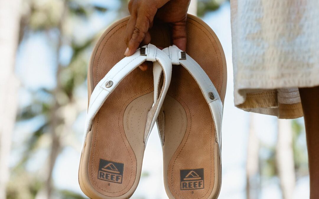 Reef sandals being held