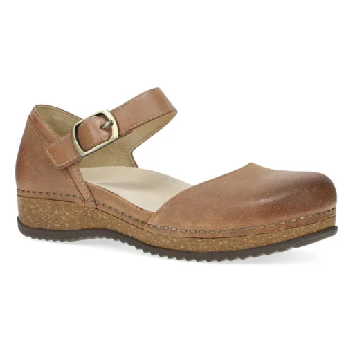 Dansko Women's Mae Mary Jane in tan burnished suede, featuring an adjustable strap, memory foam cushioning, and lightweight EVA outsole for comfort and style.