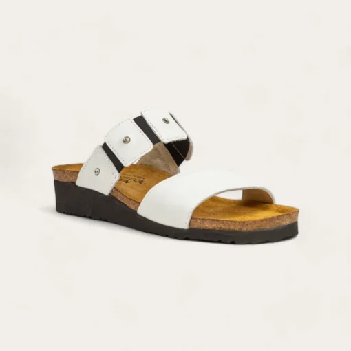 Naot Women's Ashley Sandal featuring a sleek leather upper, supportive cork and latex footbed, adjustable strap, and lightweight EVA sole for all-day comfort.