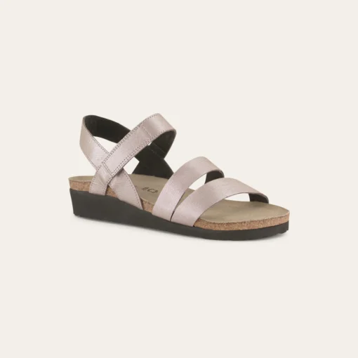 Naot Women's Kayla Sandal featuring a three-strap leather upper, supportive cork and latex footbed, adjustable strap, and durable EVA sole for all-day comfort.