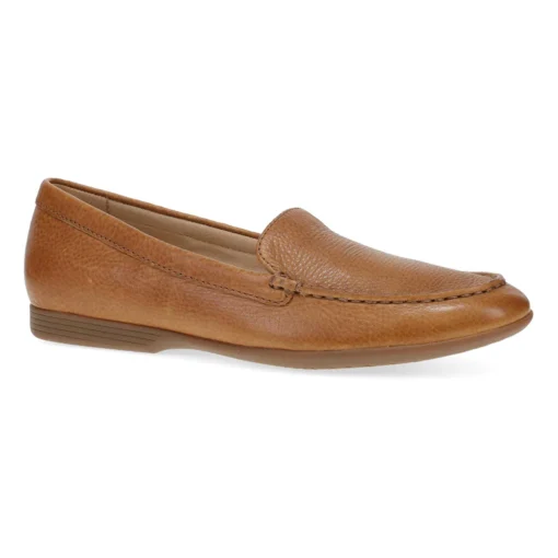 Dansko Women's Lorri Flat in tan waxy milled leather with cushioned footbed, arch support, slip-on design, and durable rubber outsole for all-day comfort