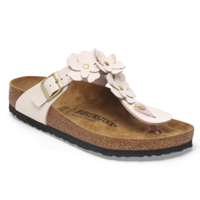 Birkenstock Women’s Gizeh Flower Sandal with a natural leather upper, floral embellishments, an anatomically shaped cork footbed, and a lightweight EVA outsole.